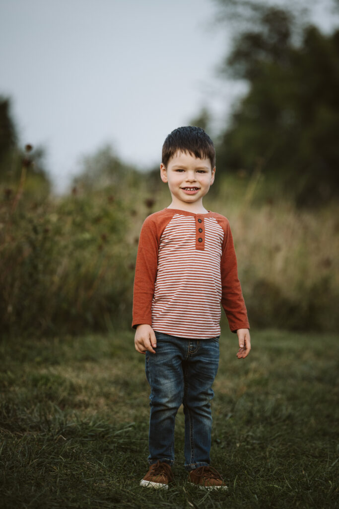 portrait of a boy in a rural field at sunset near Pittsburgh, PA