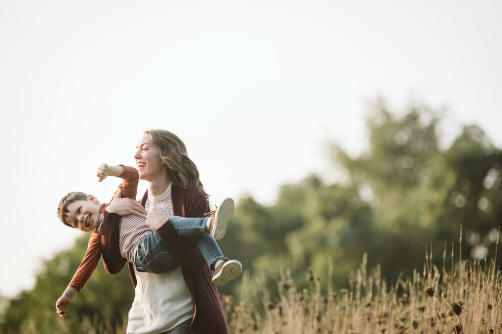 portrait of mother and son in a rural field at sunset near Pittsburgh, PA