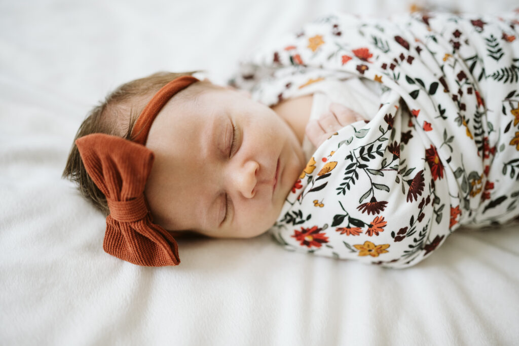 sleeping swaddled baby