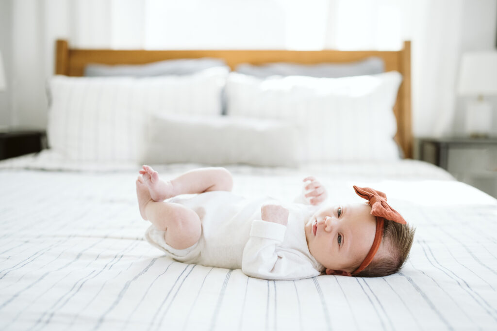 Pittsburgh newborn baby laying on bed