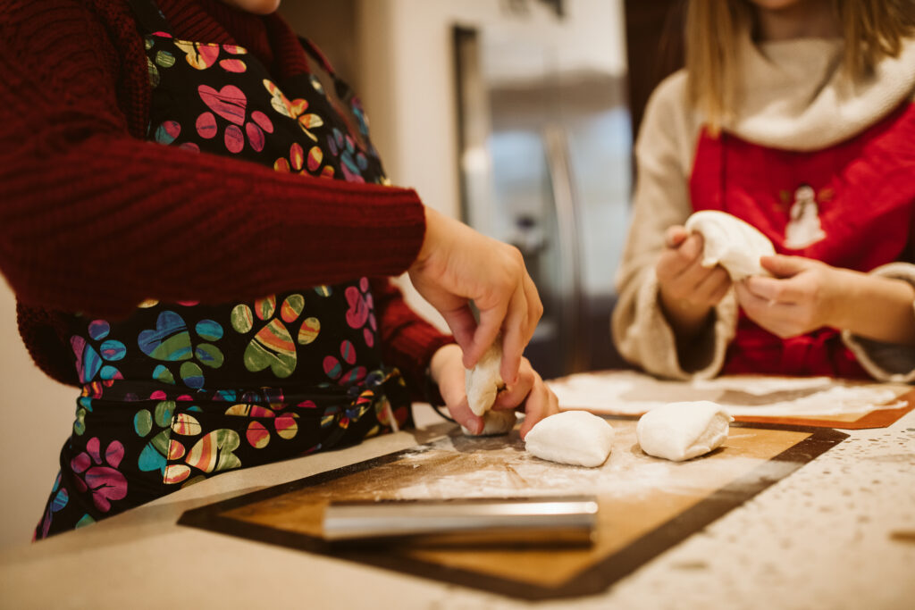 family making pizza at home