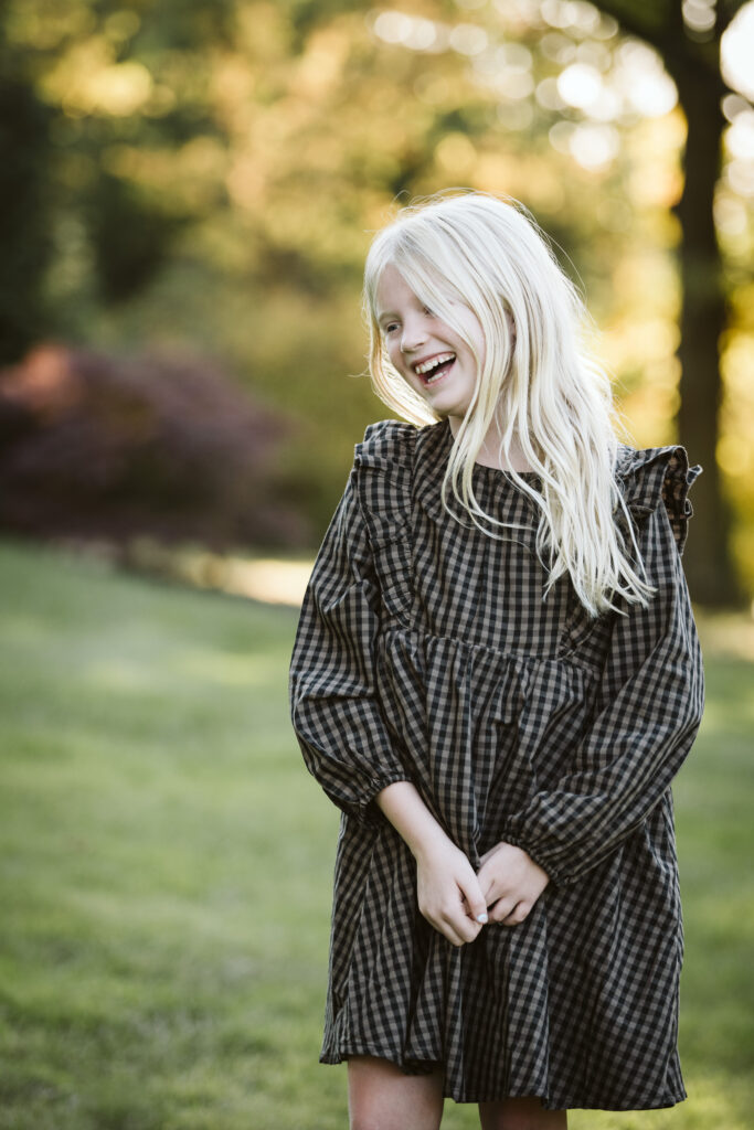 portrait of girl laughing at sunset