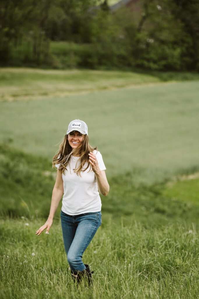 branding portrait of health coach, Green Balanced Gal, standing on a farm