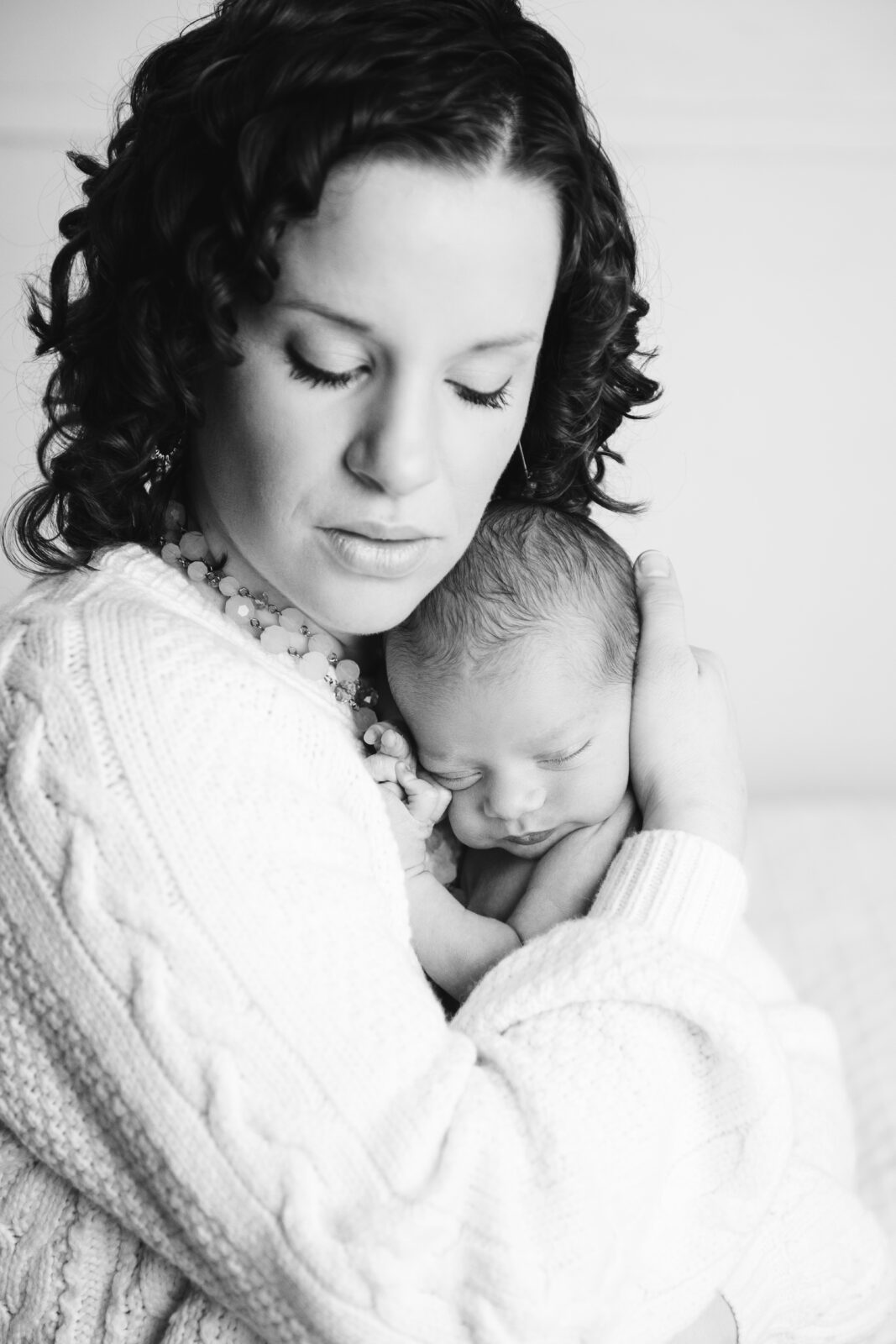 black and white newborn portrait baby with mom