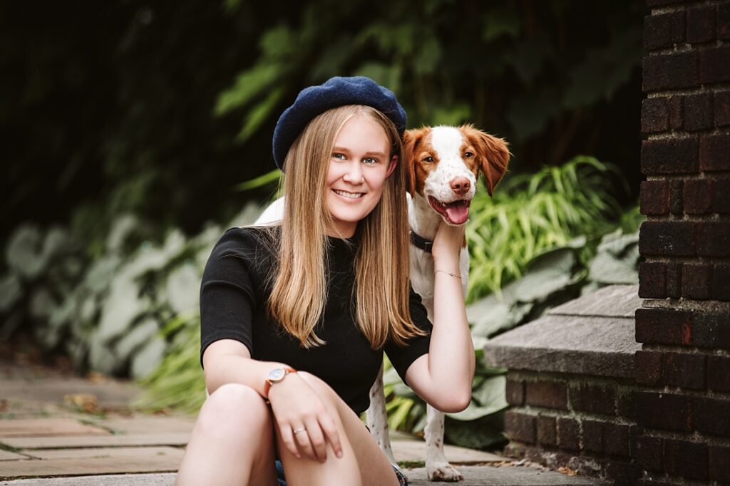 high school senior portrait of girl with dog in Pittsburgh, Mellon Park