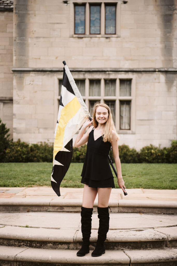 high school senior girl portrait with flag at Hartwood Mansion