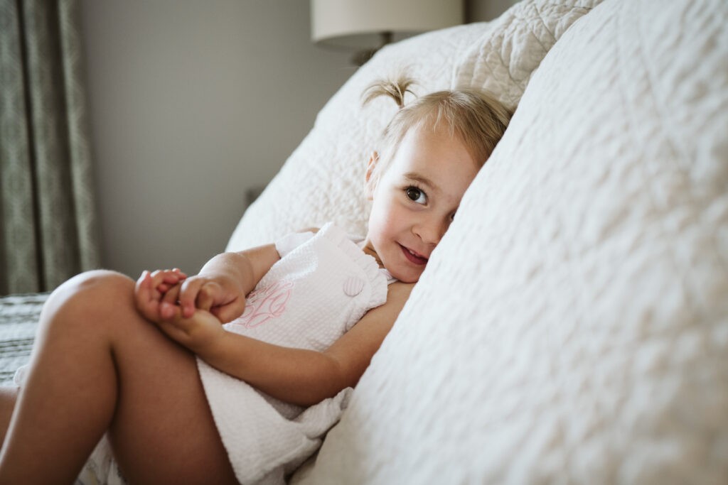 happy big sister during newborn lifestyle session