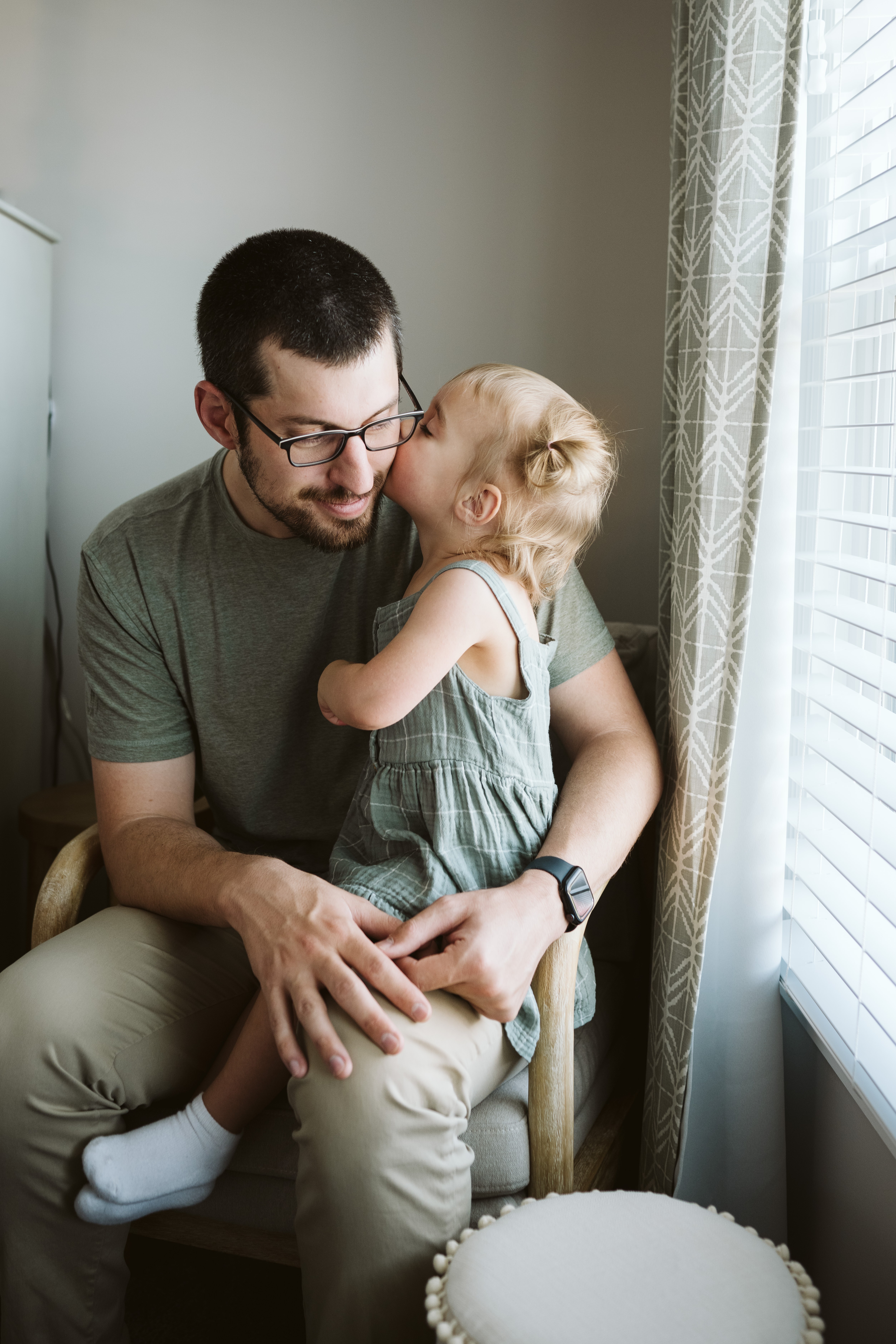 father holding daughter during newborn lifestyle session