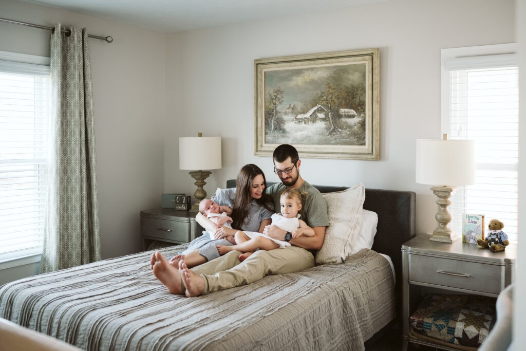 family holding children during newborn lifestyle session