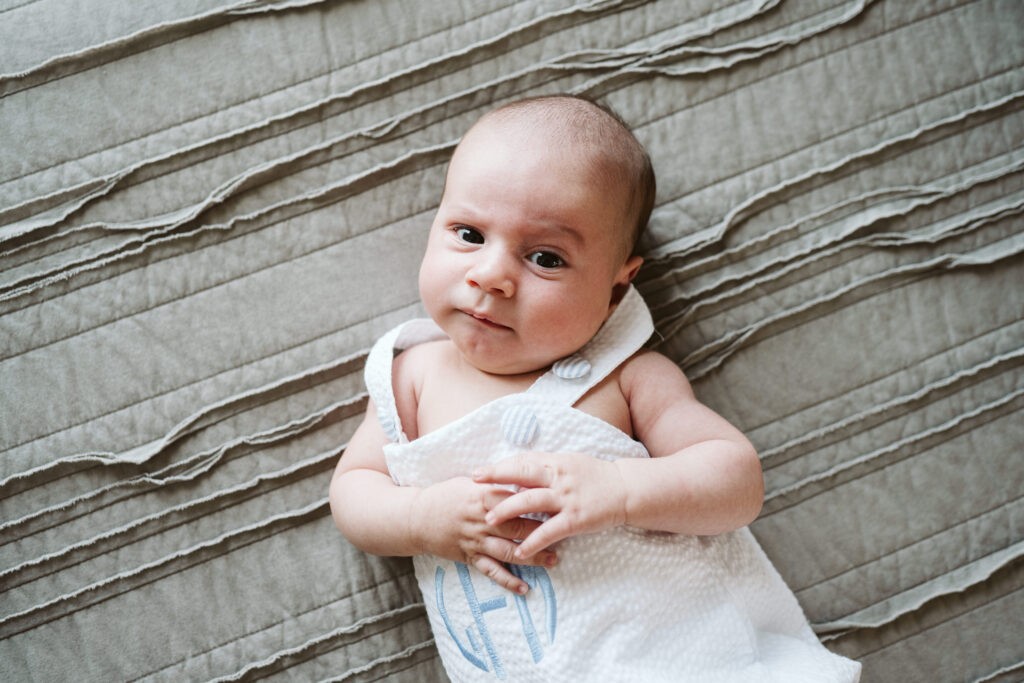 baby looking at camera during newborn lifestyle session