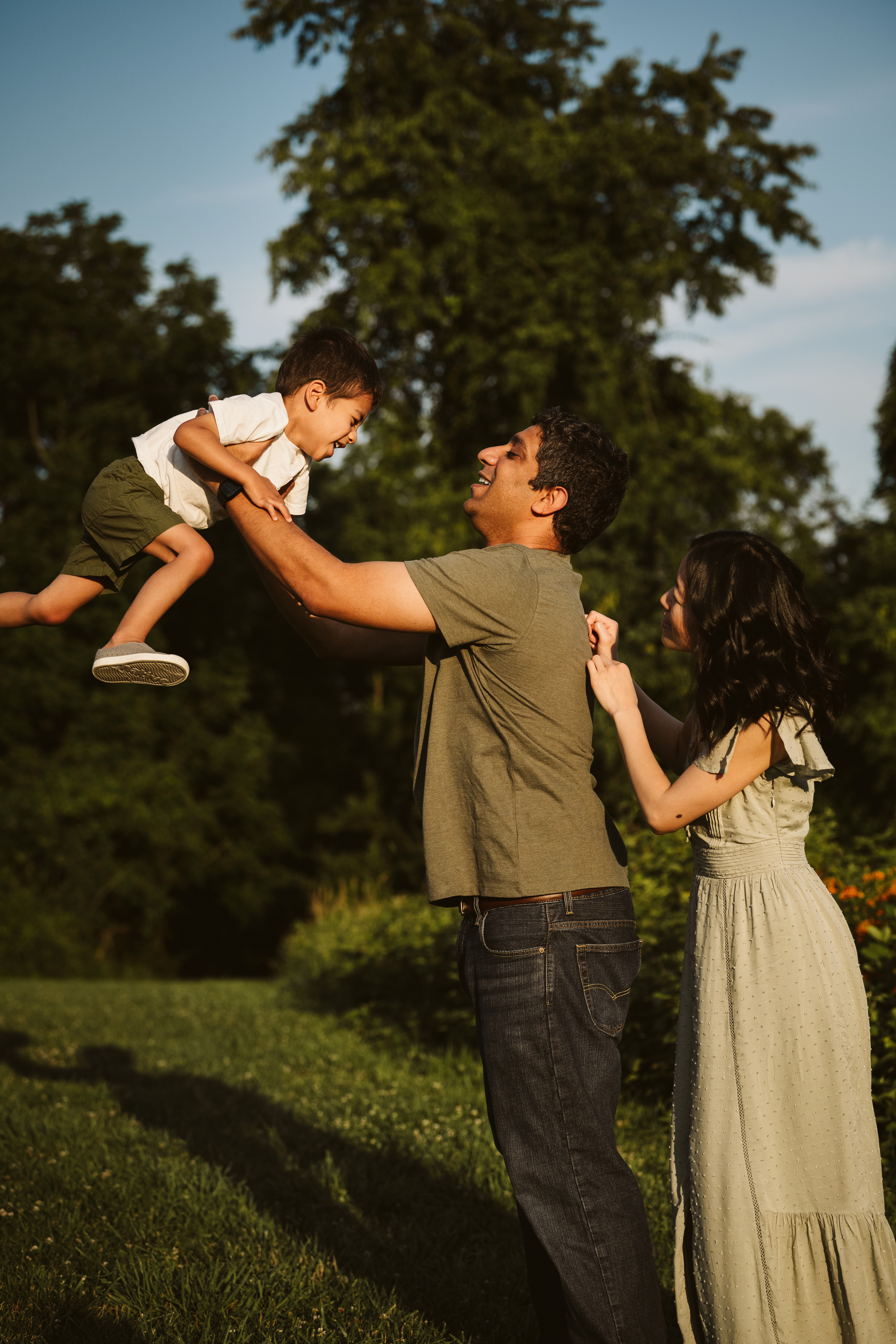 family playing during a portrait in a rural field near Pittsburgh, PA
