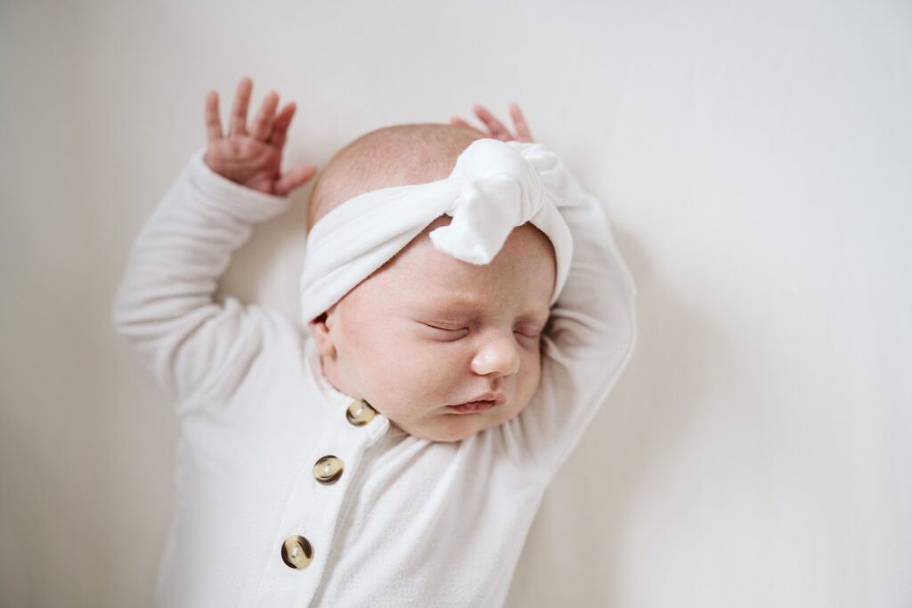 newborn baby stretching during lifestyle session