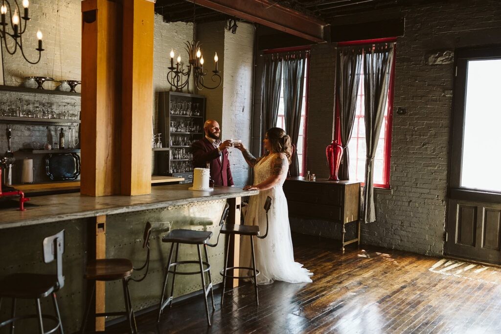 wedding couple sharing cake after they elope