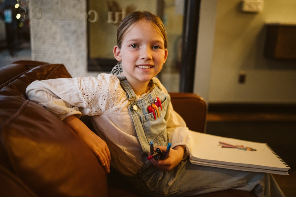 personal branding photo shoot for young artist in coffee shop