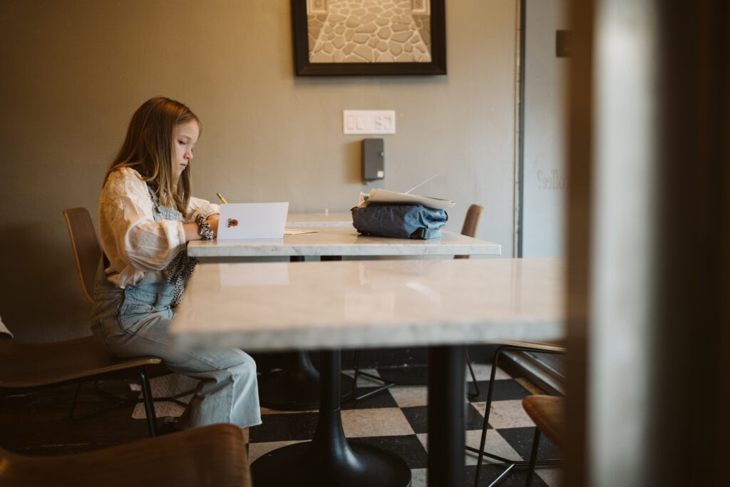 personal branding photo shoot for young artist in coffee shop