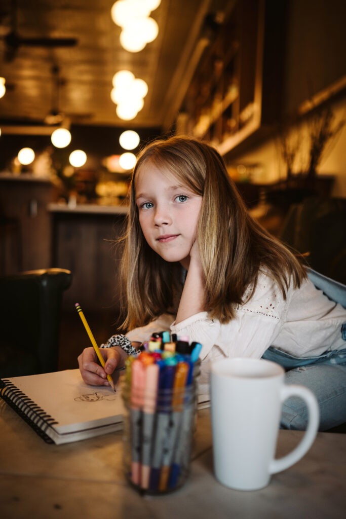 personal branding photo shoot for young artist in coffee shop