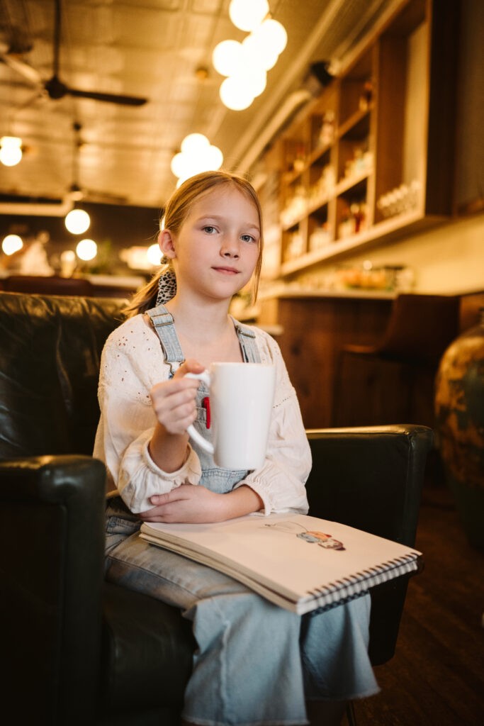 personal branding photo shoot for young artist in coffee shop