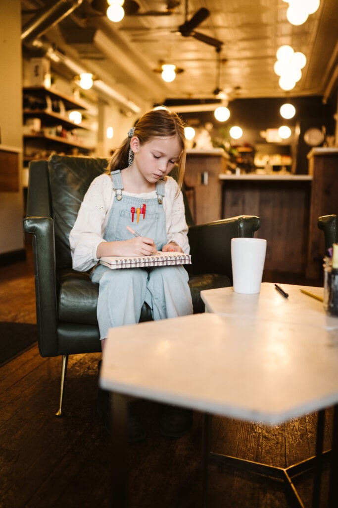 personal branding photo shoot for young artist in coffee shop