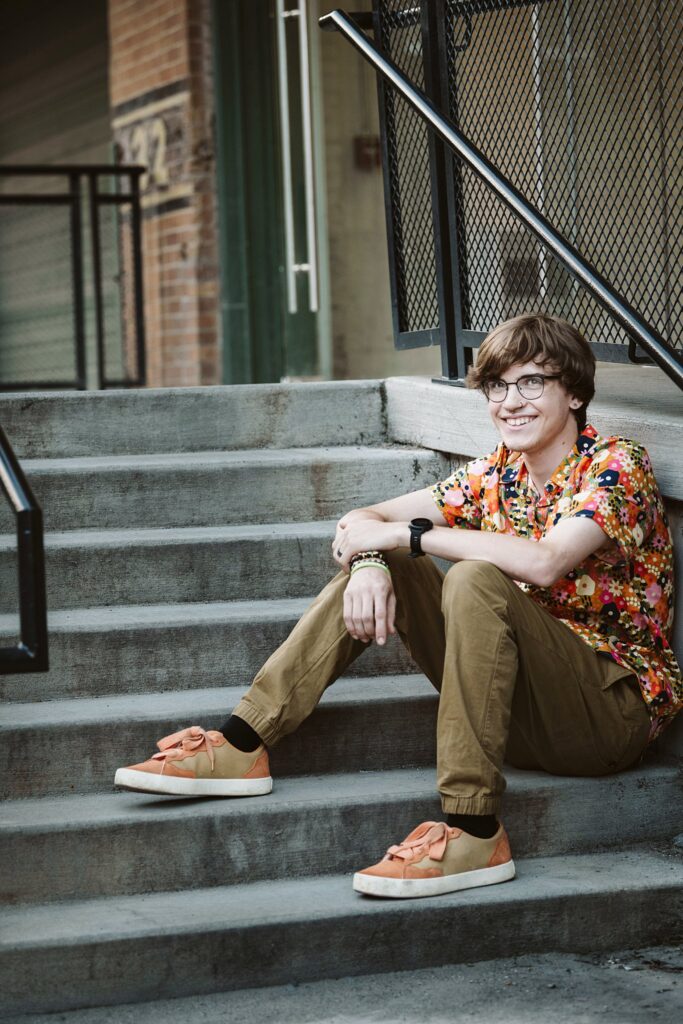 senior portrait sitting on steps