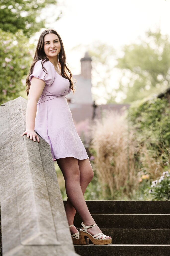 senior girl picture with flowers at sunset