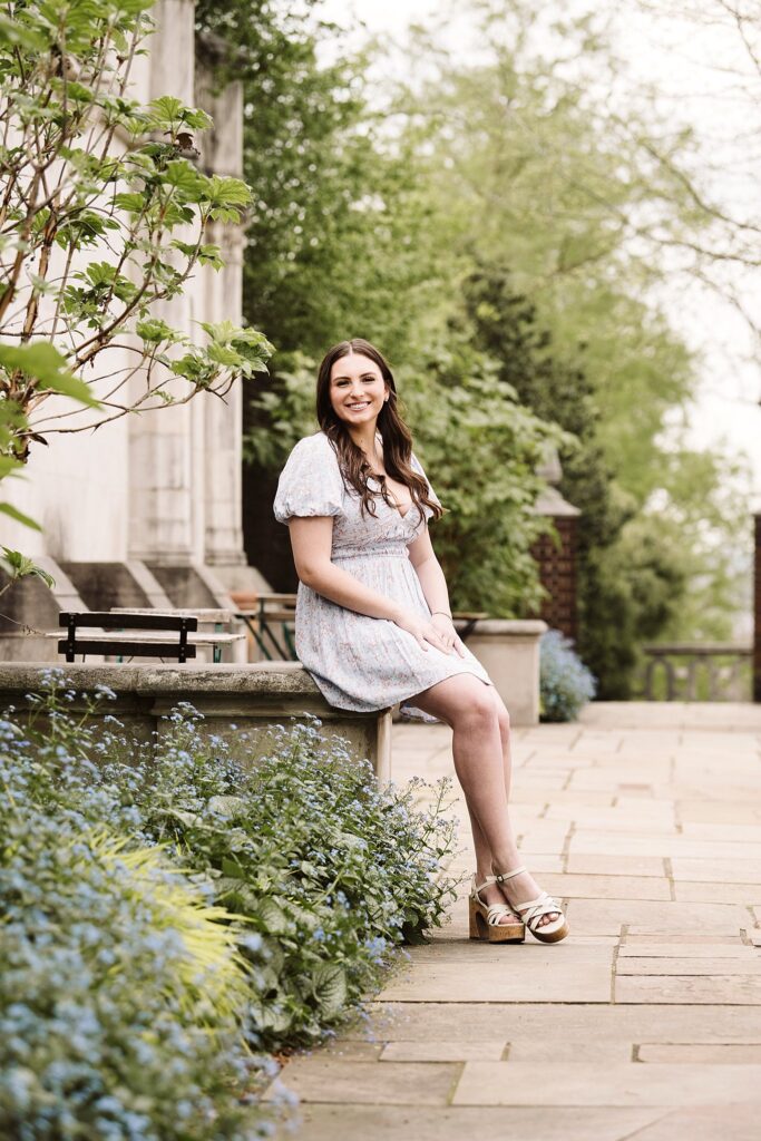 senior girl picture with flowers at sunset