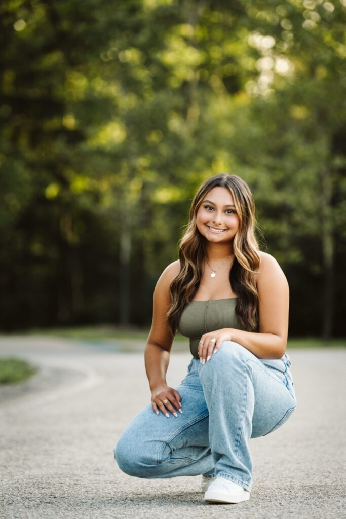 senior girl in forest at sunset