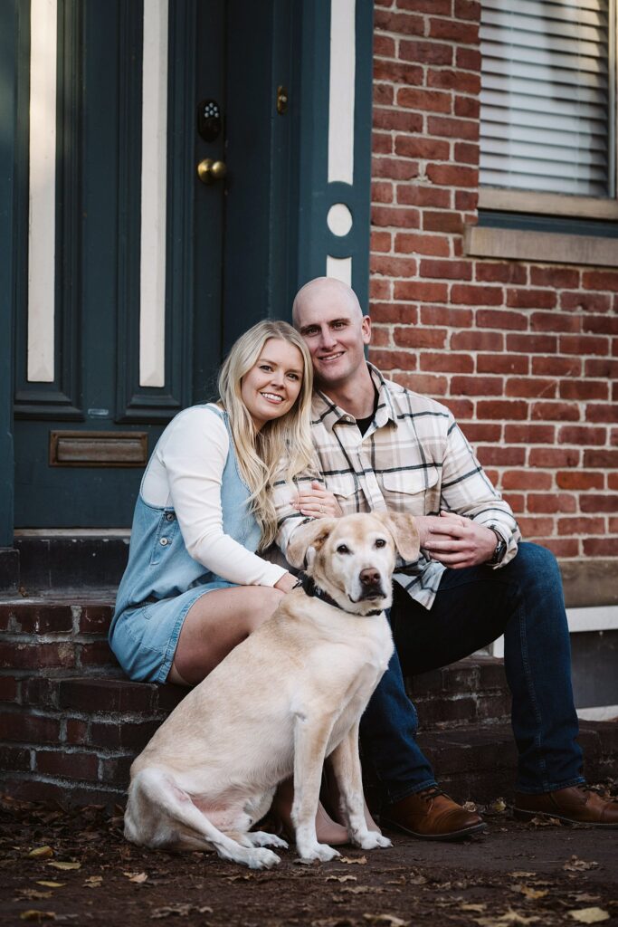 autumn engagement portrait in Pittsburgh's north side of couple with dog