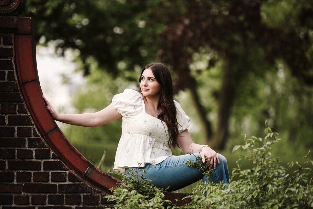 portrait of senior in flower garden at sunset