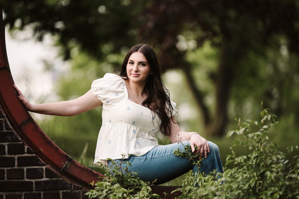 portrait of senior in flower garden at sunset