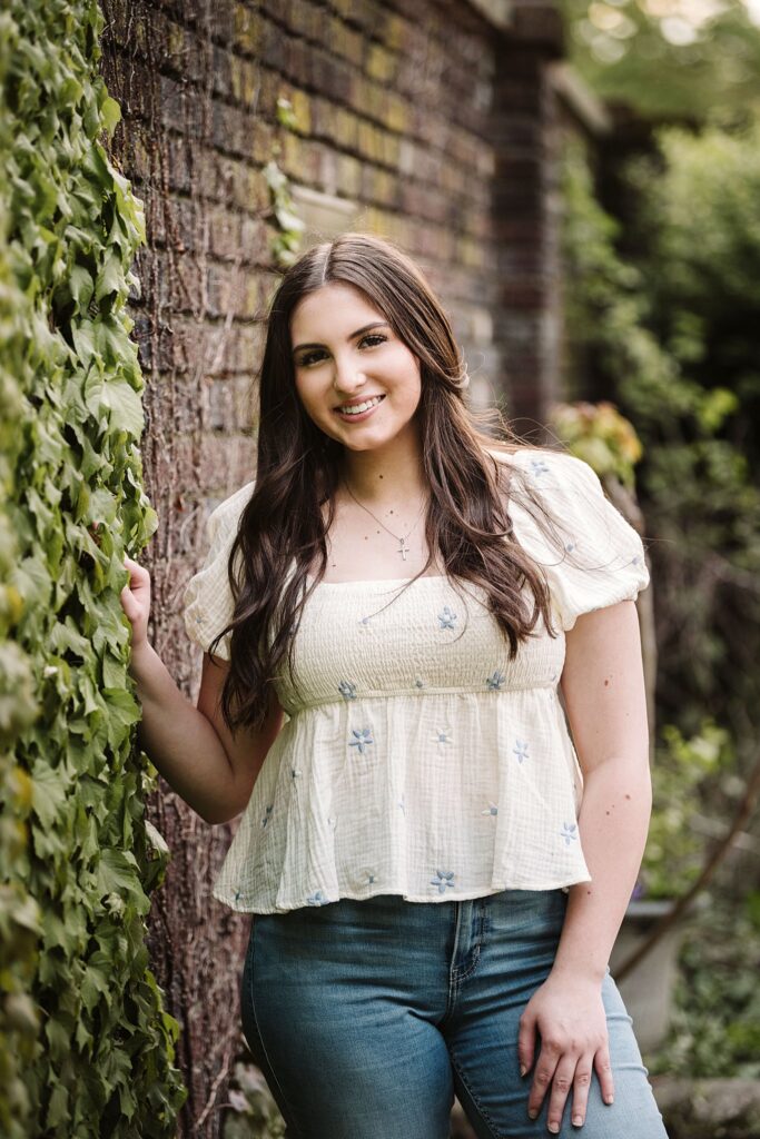 portrait of senior in flower garden at sunset