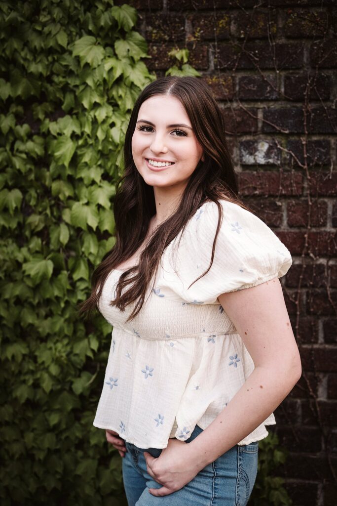 portrait of senior in flower garden at sunset