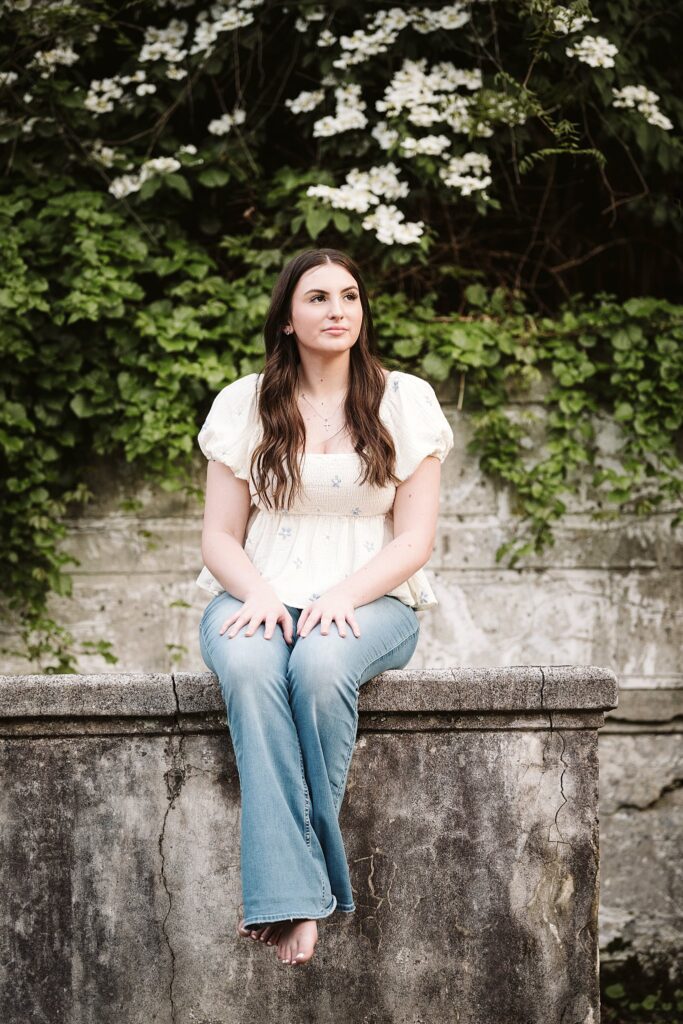 portrait of senior in flower garden at sunset