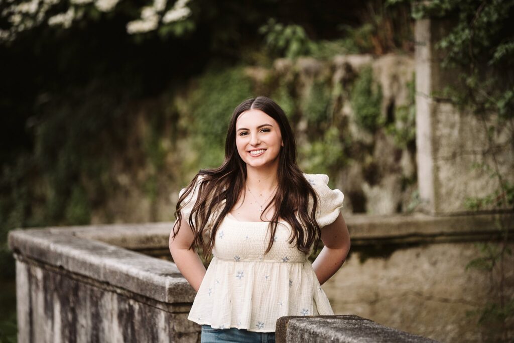 portrait of senior in flower garden at sunset