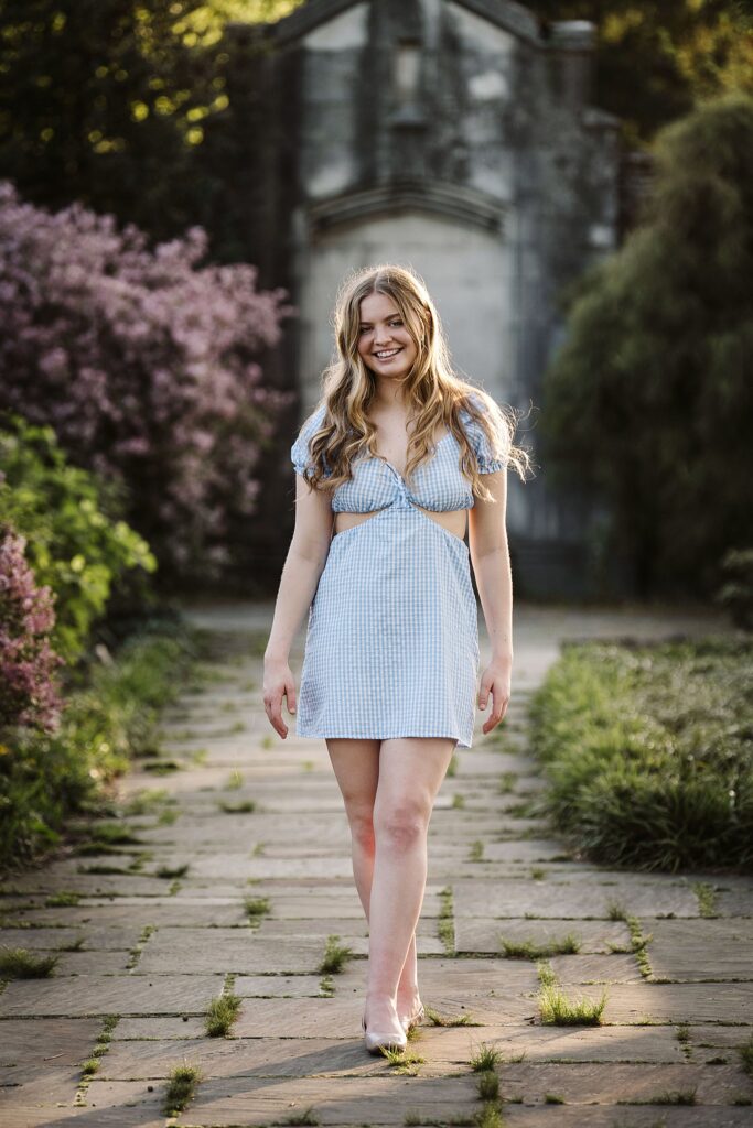 portrait of senior in flower garden at sunset