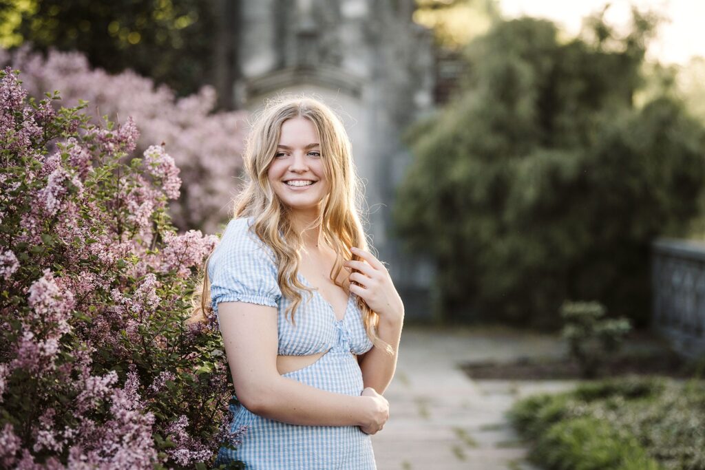 portrait of senior in flower garden at sunset