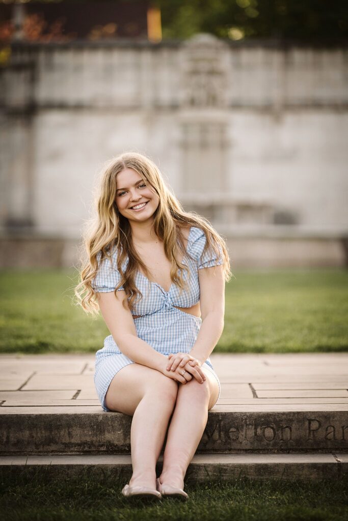 portrait of senior in flower garden at sunset