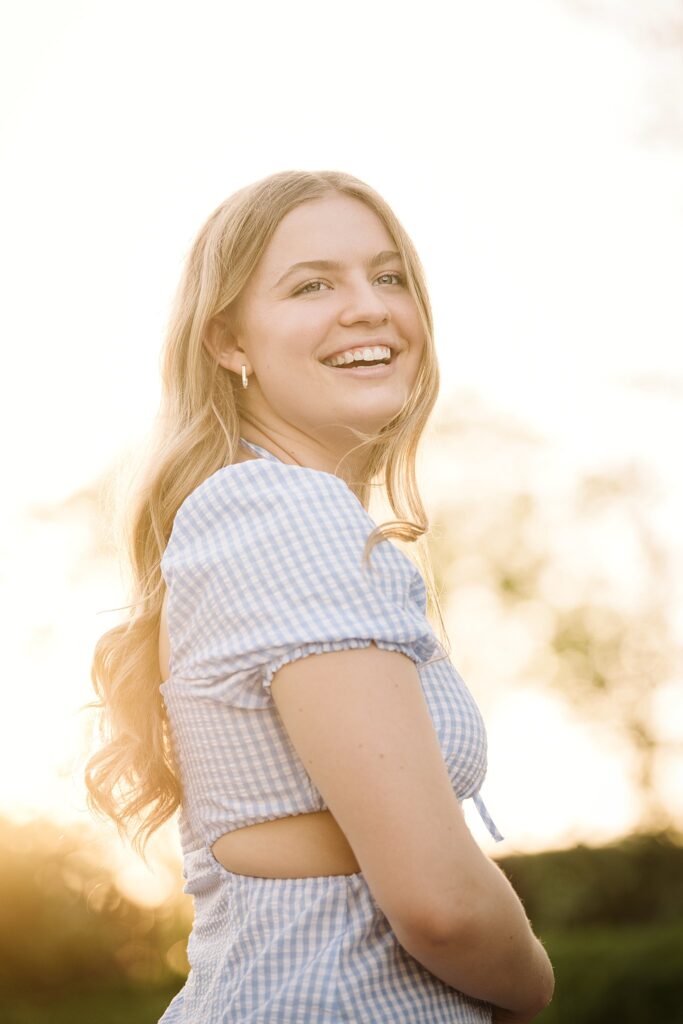 portrait of senior in Mellon Park at sunset