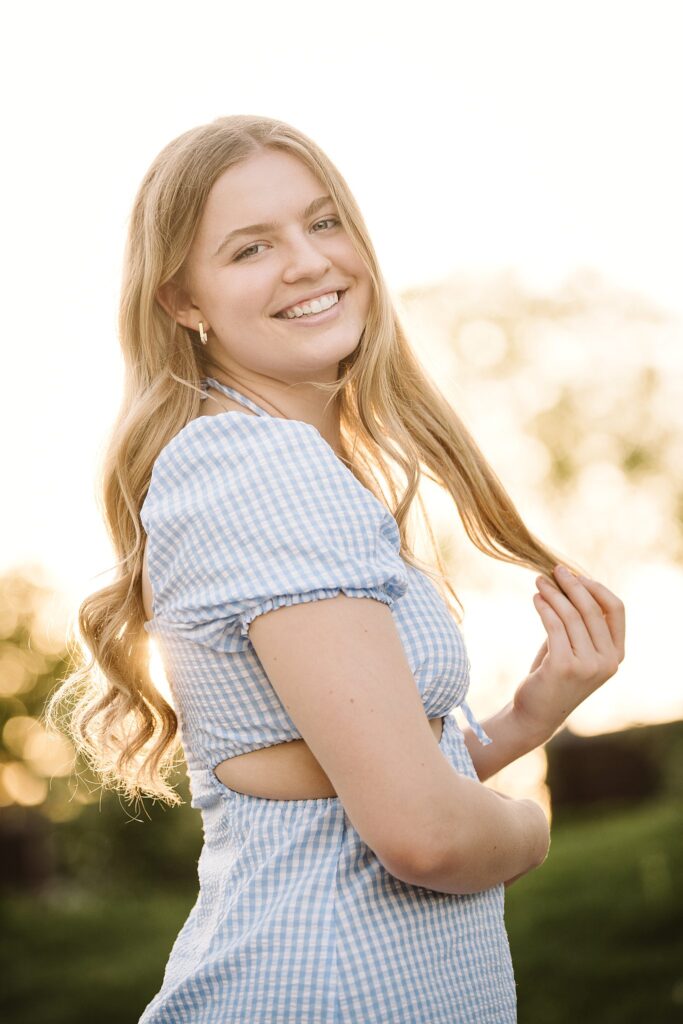 portrait of senior in Mellon Park at sunset