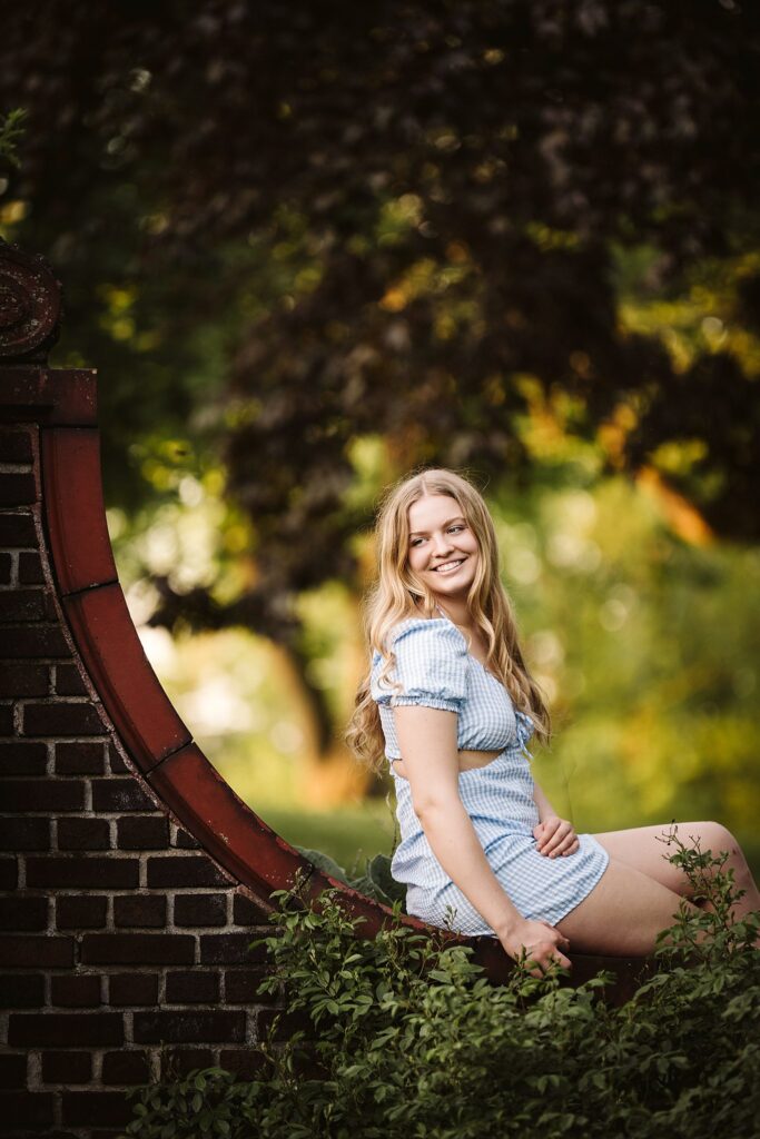 portrait of senior in flower garden at sunset