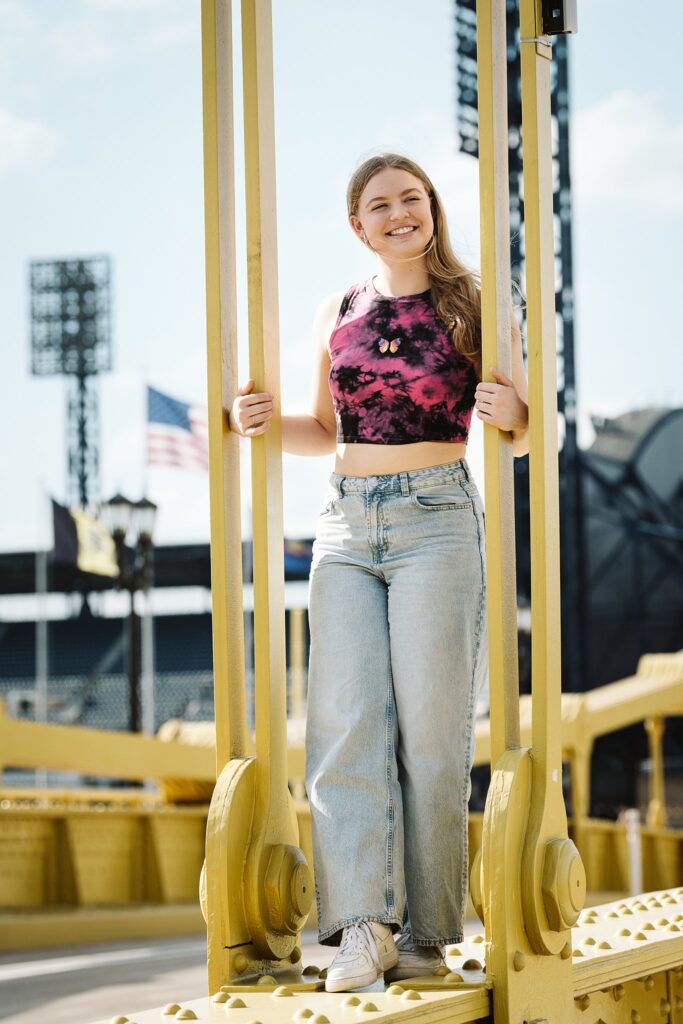 senior portrait on Roberto Clemente bridge in Pittsburgh