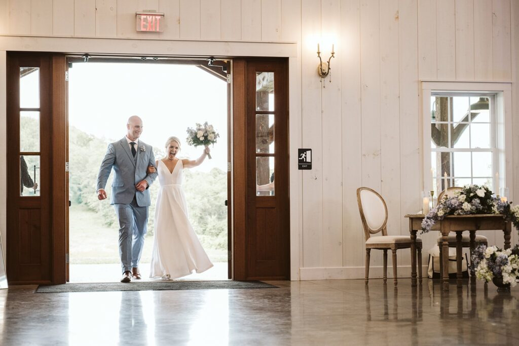 bride and groom entering the reception at The Grayson House