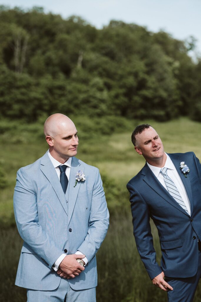 groom and best man look for the bride