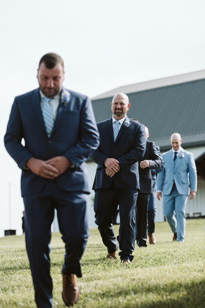 groom and groomsmen enter wedding ceremony at The Grayson House