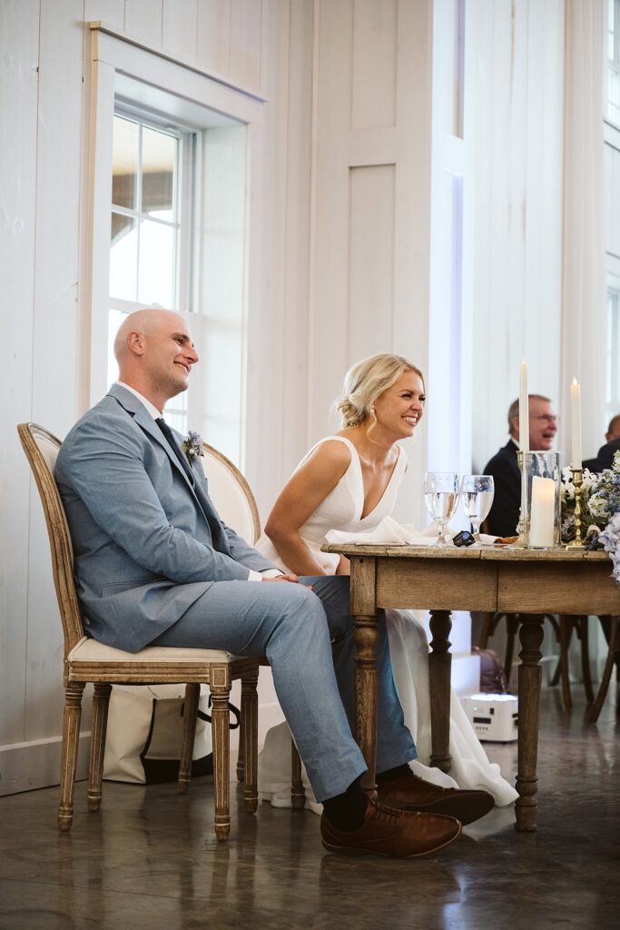 bride and groom at sweetheart table at Grayson House