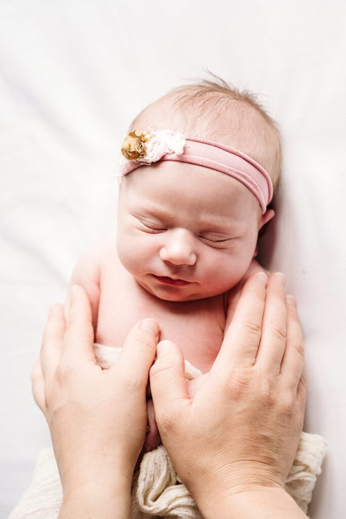 newborn being soothed during photoshoot