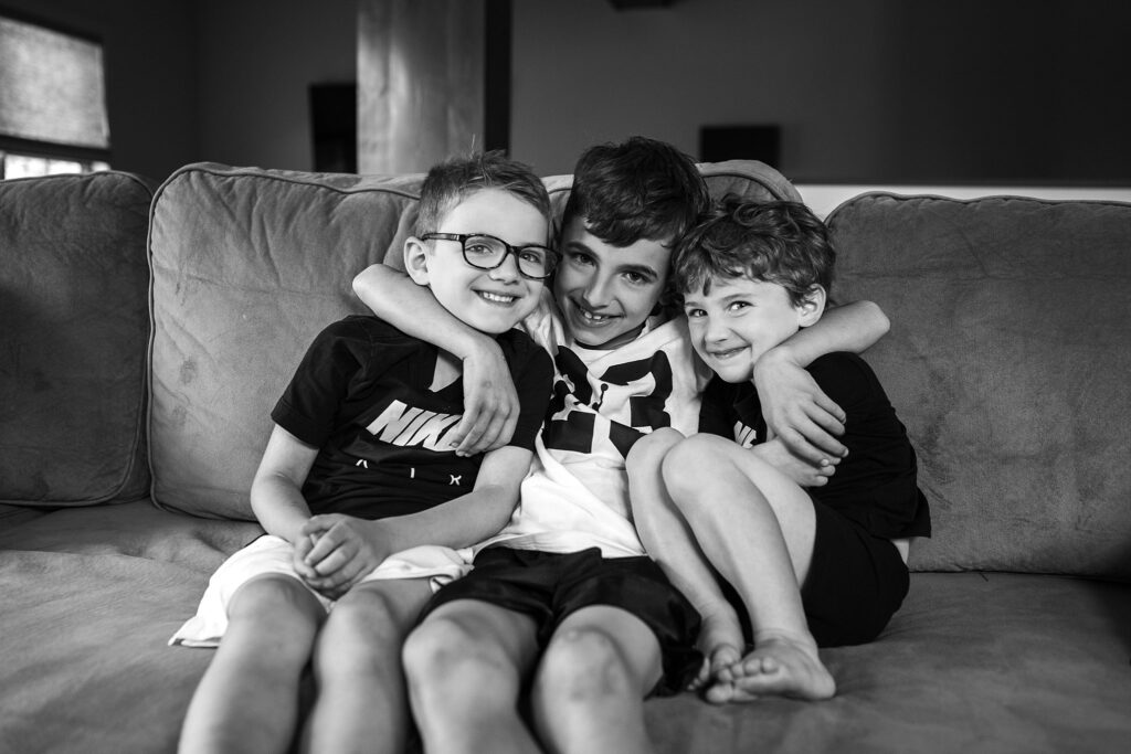 three boys sitting on a sofa during a lifestyle photoshoot at home in Pittsburgh