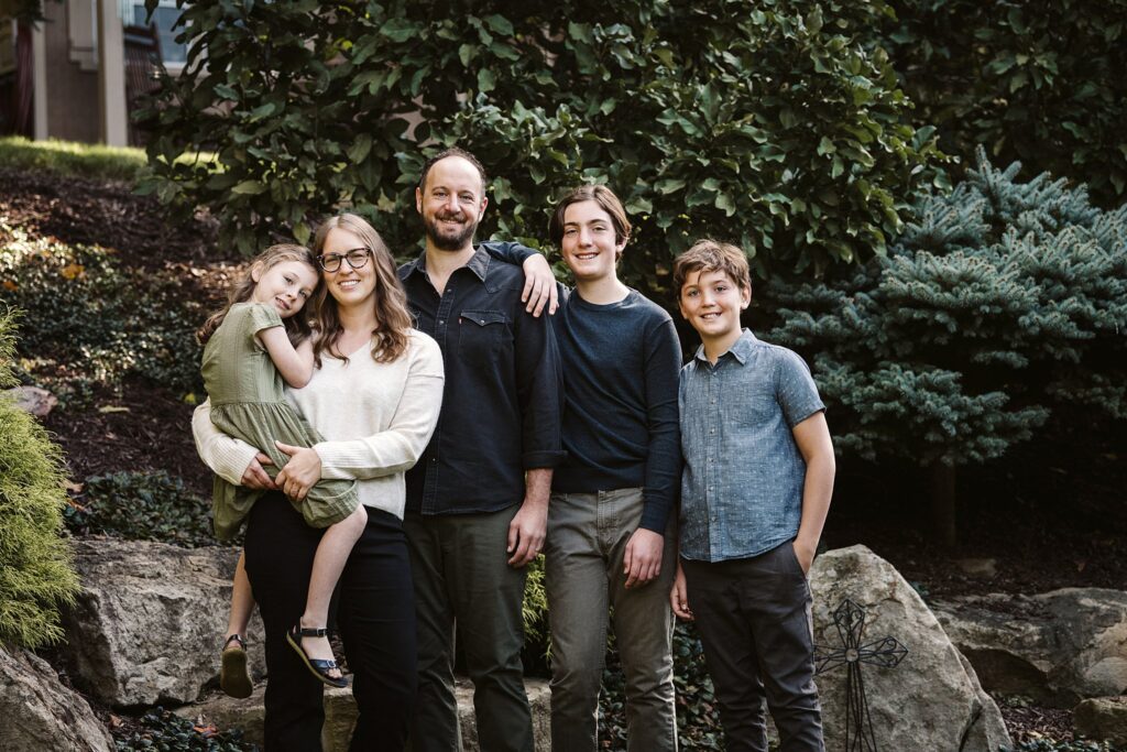 individual family captured during extended family session in family's backyard