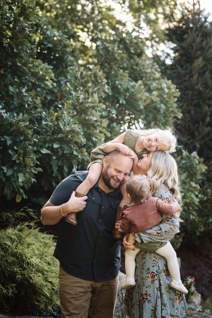 individual family captured during extended family session in family's backyard