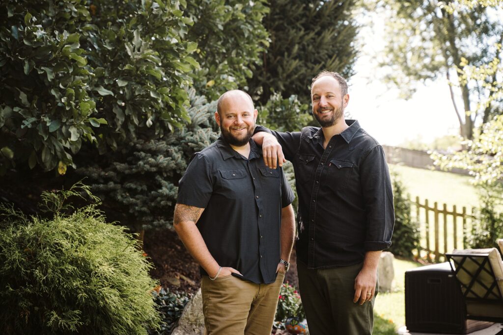 portrait of brothers at extended family captured in family's backyard