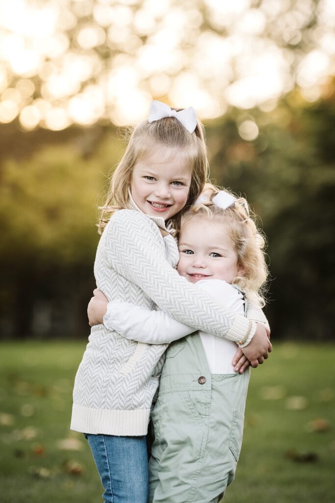 portrait of sisters at sunset